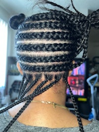 a woman with braids in her hair