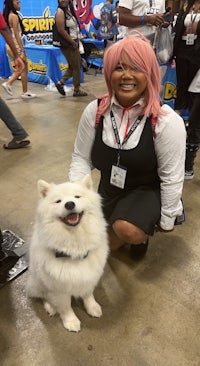 a woman posing with a white dog